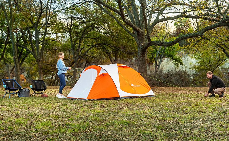 2 people setting up portable moon lence camping tent