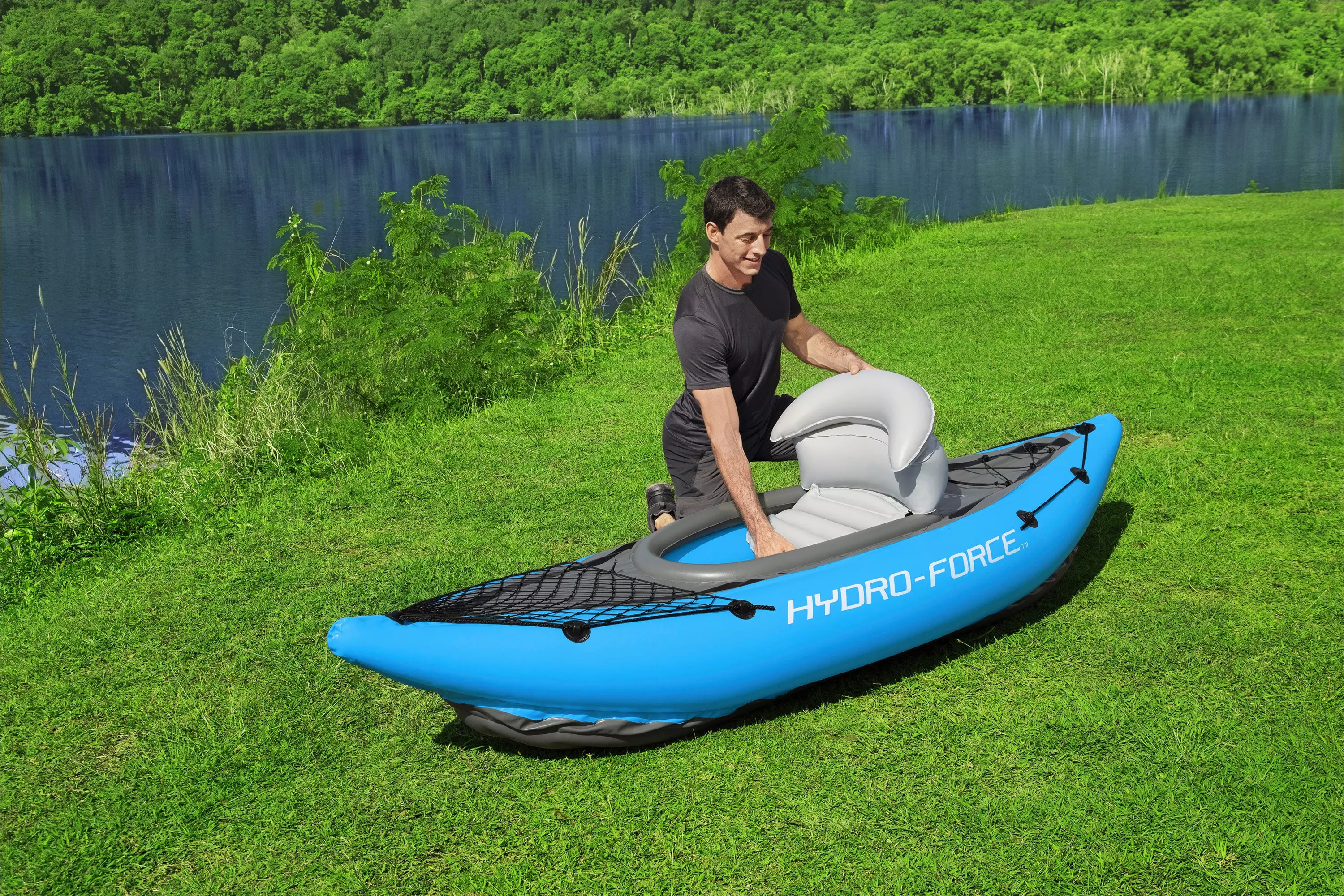 Adjustable seats of the kayak in a grass background next to a lake