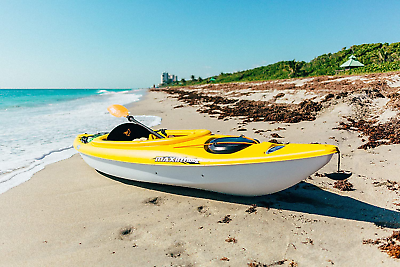 Yellow Maxim 100x Kayak in the sand with a beach background